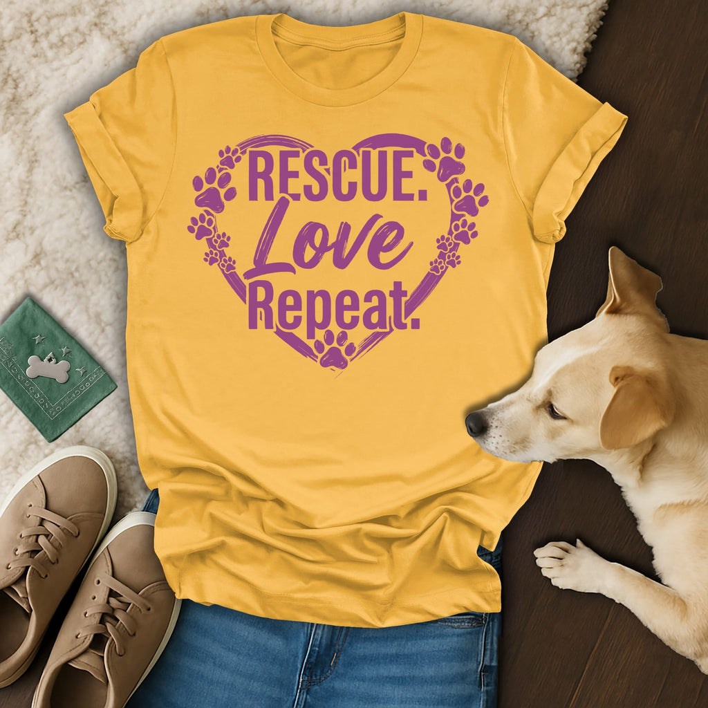 Yellow t-shirt with "Rescue. Love. Repeat." and paw prints in a heart.
