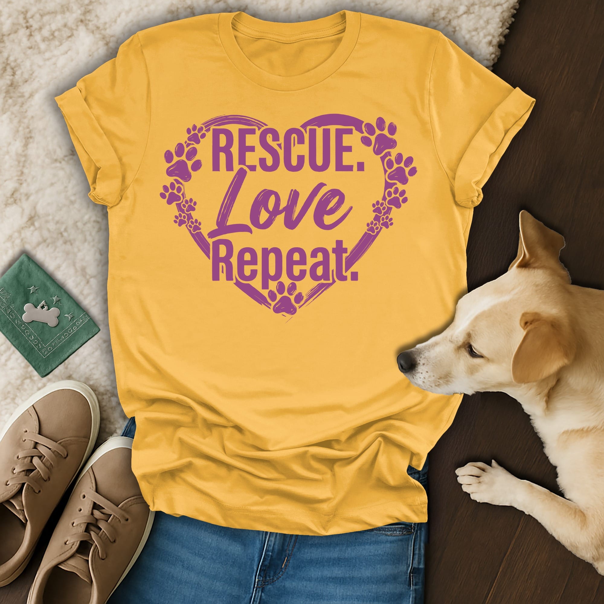 Yellow t-shirt with "Rescue. Love. Repeat." and paw prints in a heart.