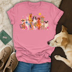 Pink t-shirt with cartoon dogs in beach attire and accessories.