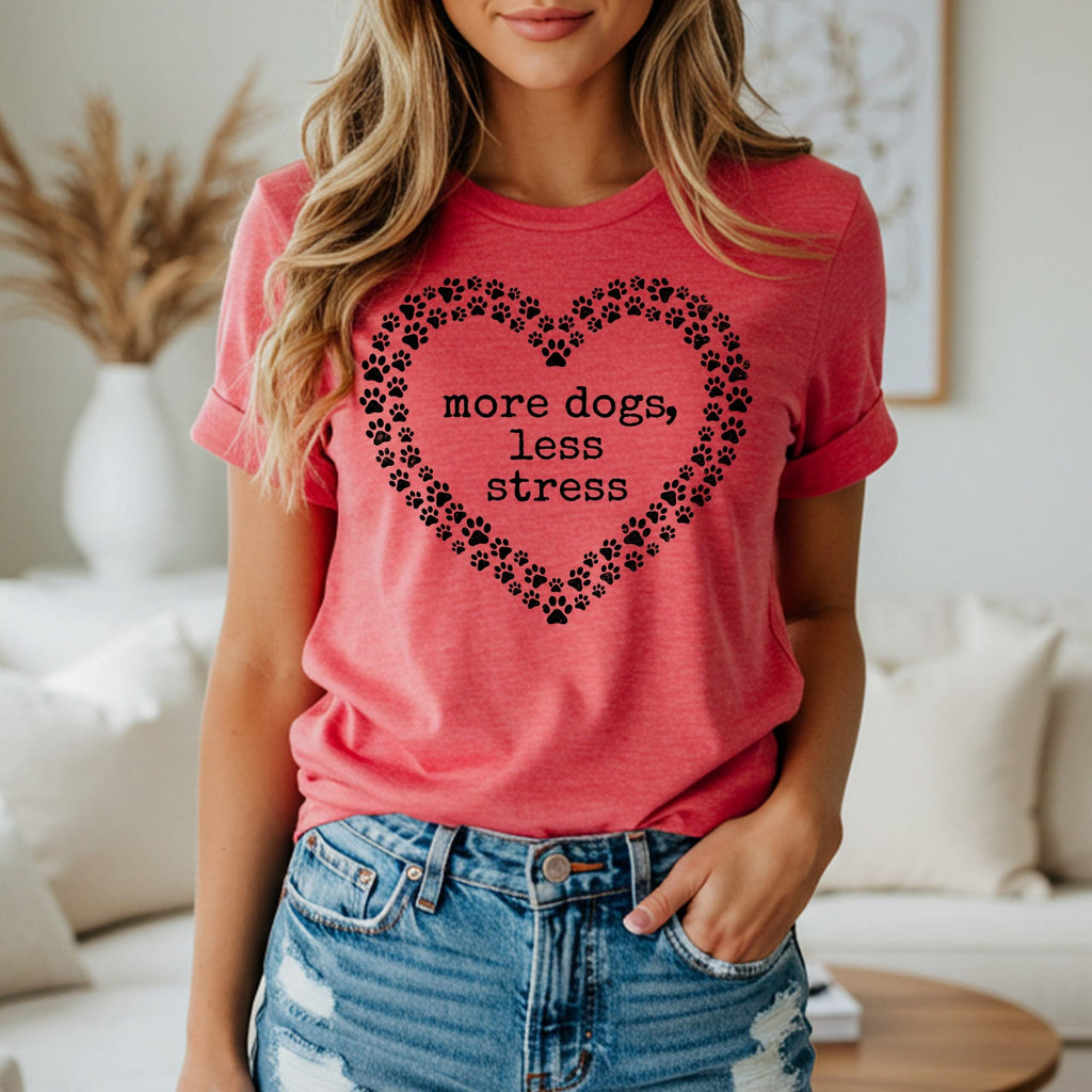 Red t-shirt with black paw print heart and text "more dogs, less stress".