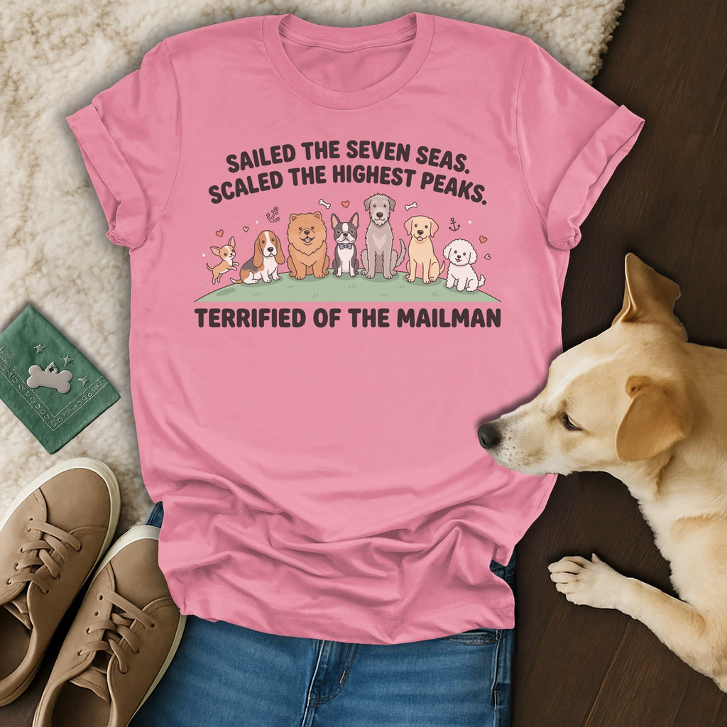 Pink t-shirt with dogs and text "SAILED THE SEVEN SEAS. SCALED THE HIGHEST PEAKS. TERRIFIED OF THE MAILMAN".
