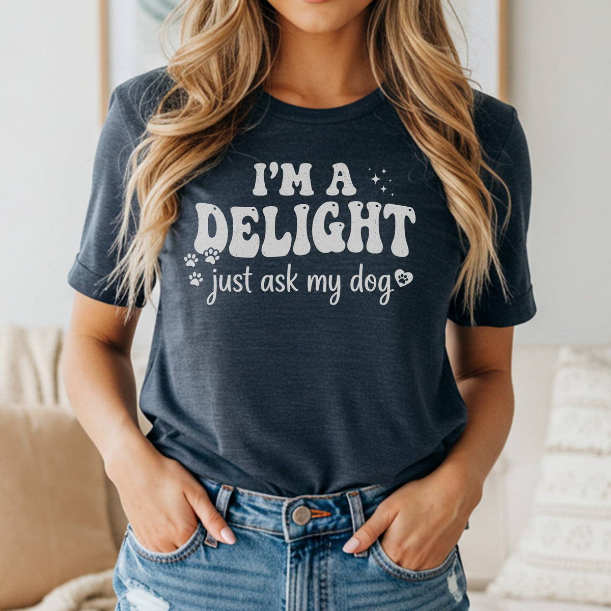 Dark blue t-shirt with "I'm a delight just ask my dog" text and paw prints.
