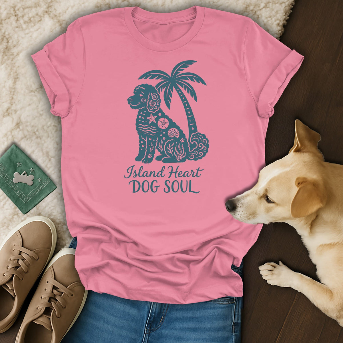 Pink t-shirt with teal dog, palm tree, and text "Island Heart DOG SOUL" graphic.