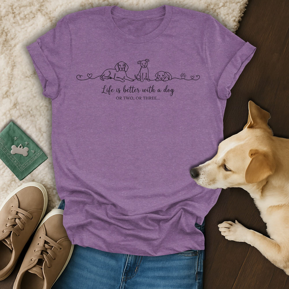 Purple t-shirt with line drawings of dogs and text "Life is better with a dog OR TWO, OR THREE..."