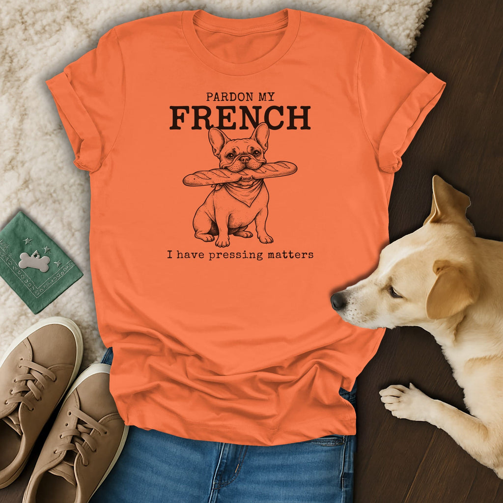 Orange t-shirt with French bulldog holding baguette and text "Pardon My French".
