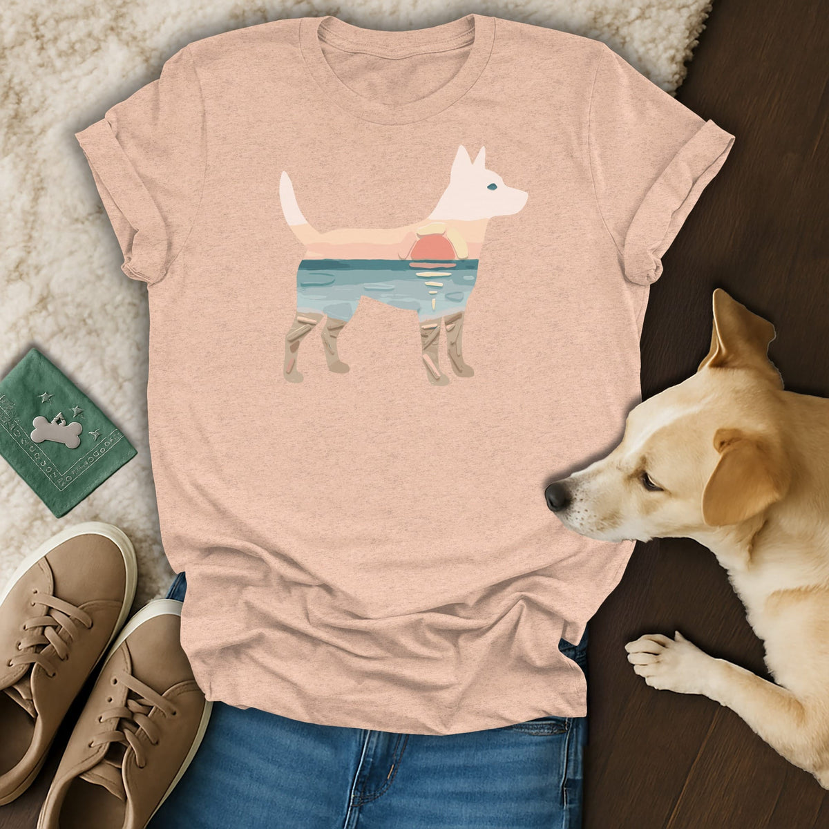Peach t-shirt with a white dog silhouette filled with a beach sunset scene.