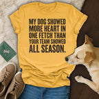 Yellow t-shirt with black text: "My dog showed more heart in one fetch than your team showed all season."