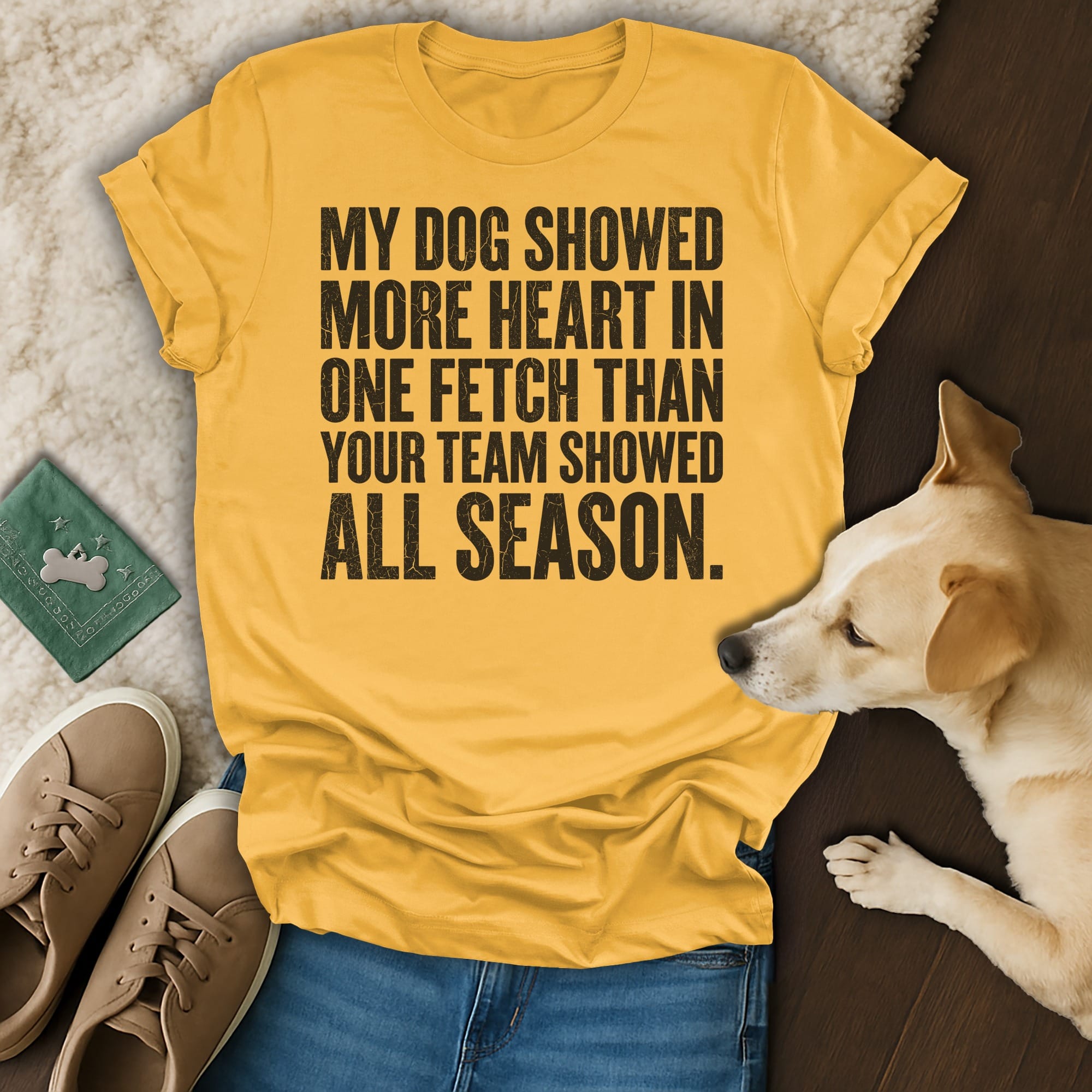 Yellow t-shirt with black text: "My dog showed more heart in one fetch than your team showed all season."