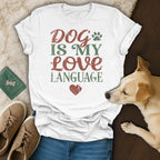 White t-shirt with "DOG IS MY LOVE LANGUAGE" text and a heart.