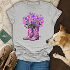 Pink and purple paw prints in cowboy boots with greenery.