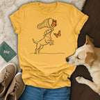 Yellow t-shirt with black line drawing of a dog catching butterflies.
