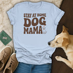 Light blue t-shirt with brown text "STAY AT HOME DOG MAMA" and a dog illustration.