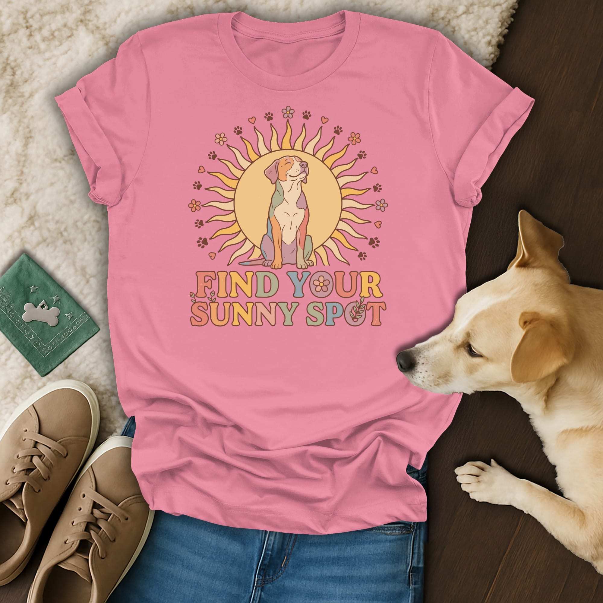 Pink t-shirt with a dog sitting in a sun graphic and "Find Your Sunny Spot" text.