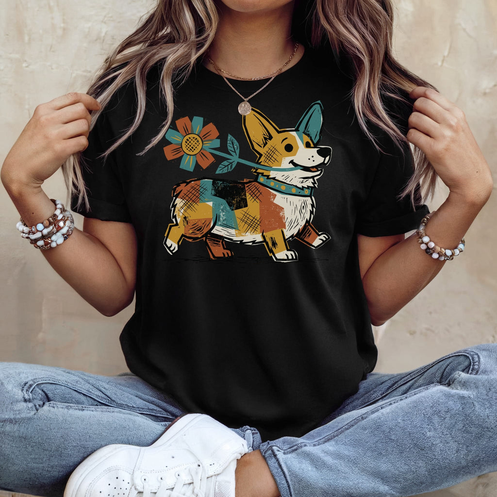 Black t-shirt with a cartoon corgi holding a flower, wearing a colorful bandana.