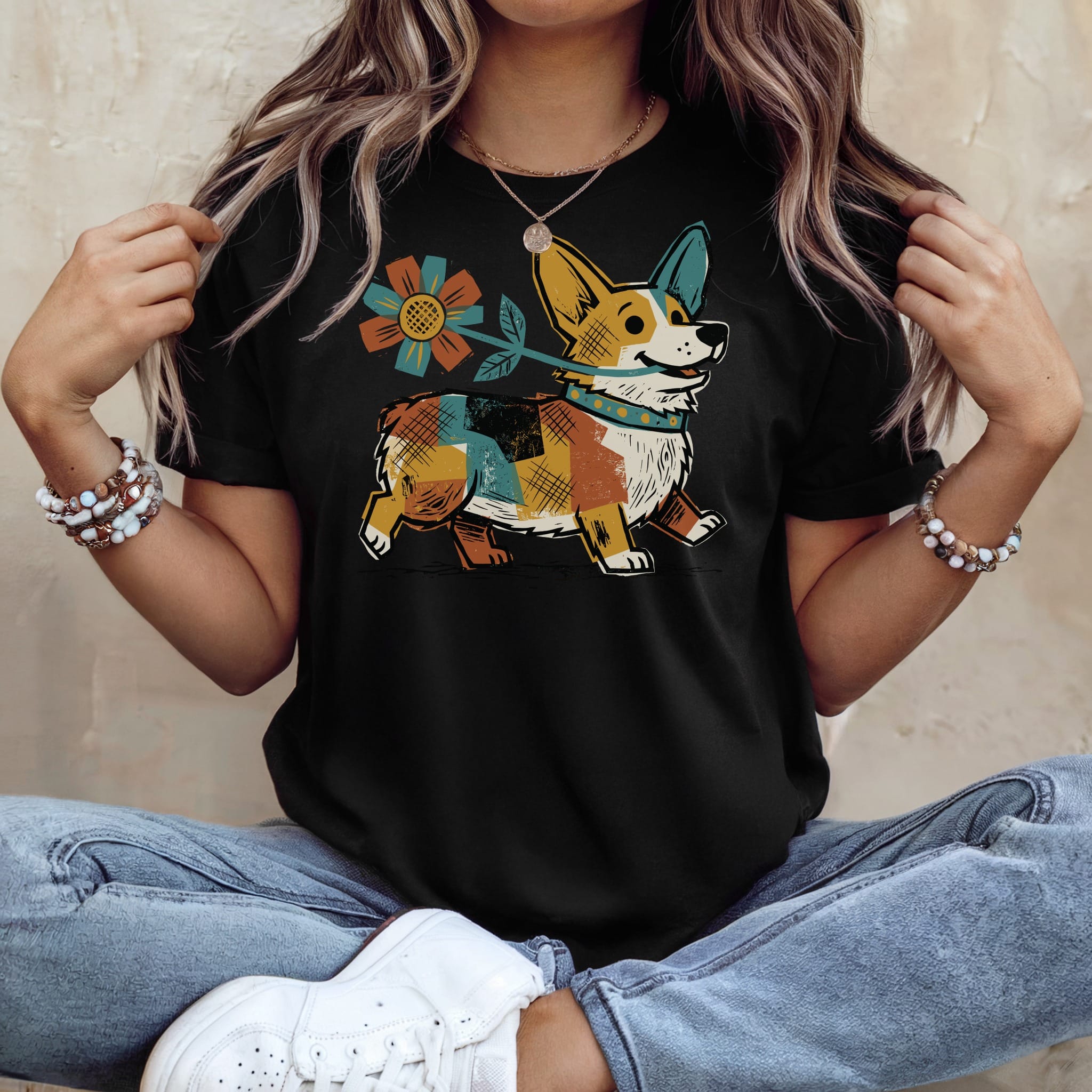Black t-shirt with a cartoon corgi holding a flower, wearing a colorful bandana.