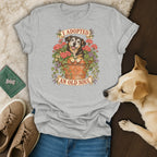 Heather gray t-shirt with a vintage graphic of a dog in a flower pot and the text I ADOPTED AN OLD SOUL.