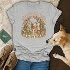 Heather gray t-shirt featuring a graphic of a dog walking through a garden gate with text reading Second Chances Bloom Here.