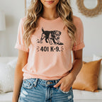 Peach t-shirt with a black graphic of a dog digging and text "401 K-9.".