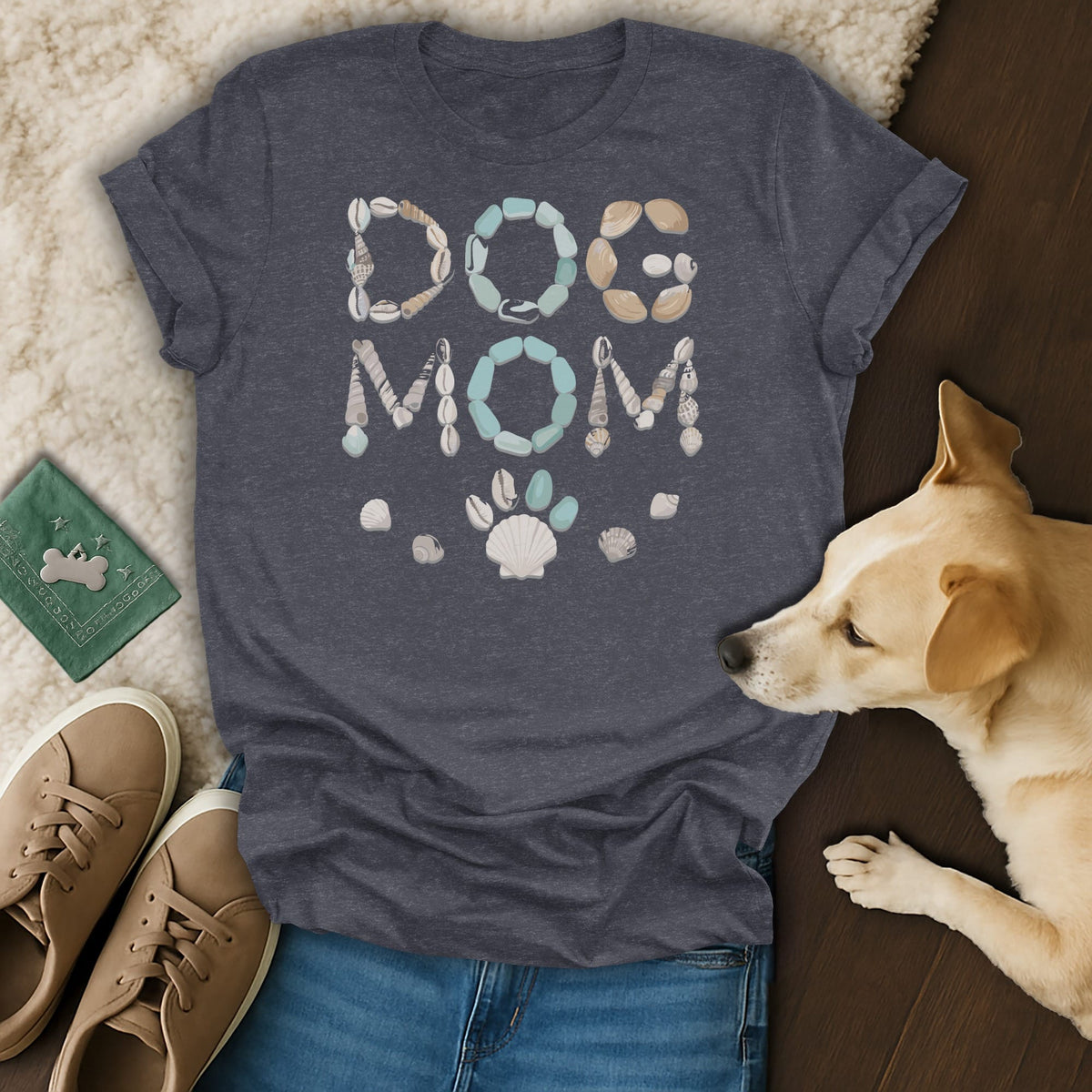 Dark grey t-shirt with "DOG MOM" in shell and sea glass design and a paw print.