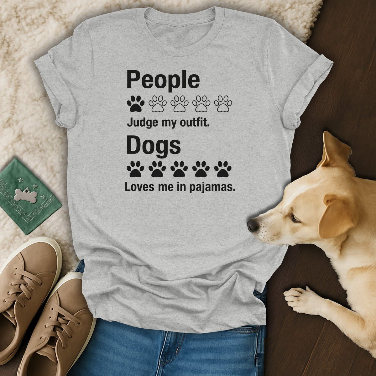 Grey t-shirt with black text: "People Judge my outfit. Dogs Loves me in pajamas."