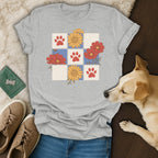 Grey t-shirt with a floral and paw print grid design.