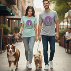 Couple walking two dogs in casual t-shirts with a dancing cat graphic.