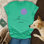 Teal t-shirt with silhouette of dog looking at a purple moon.