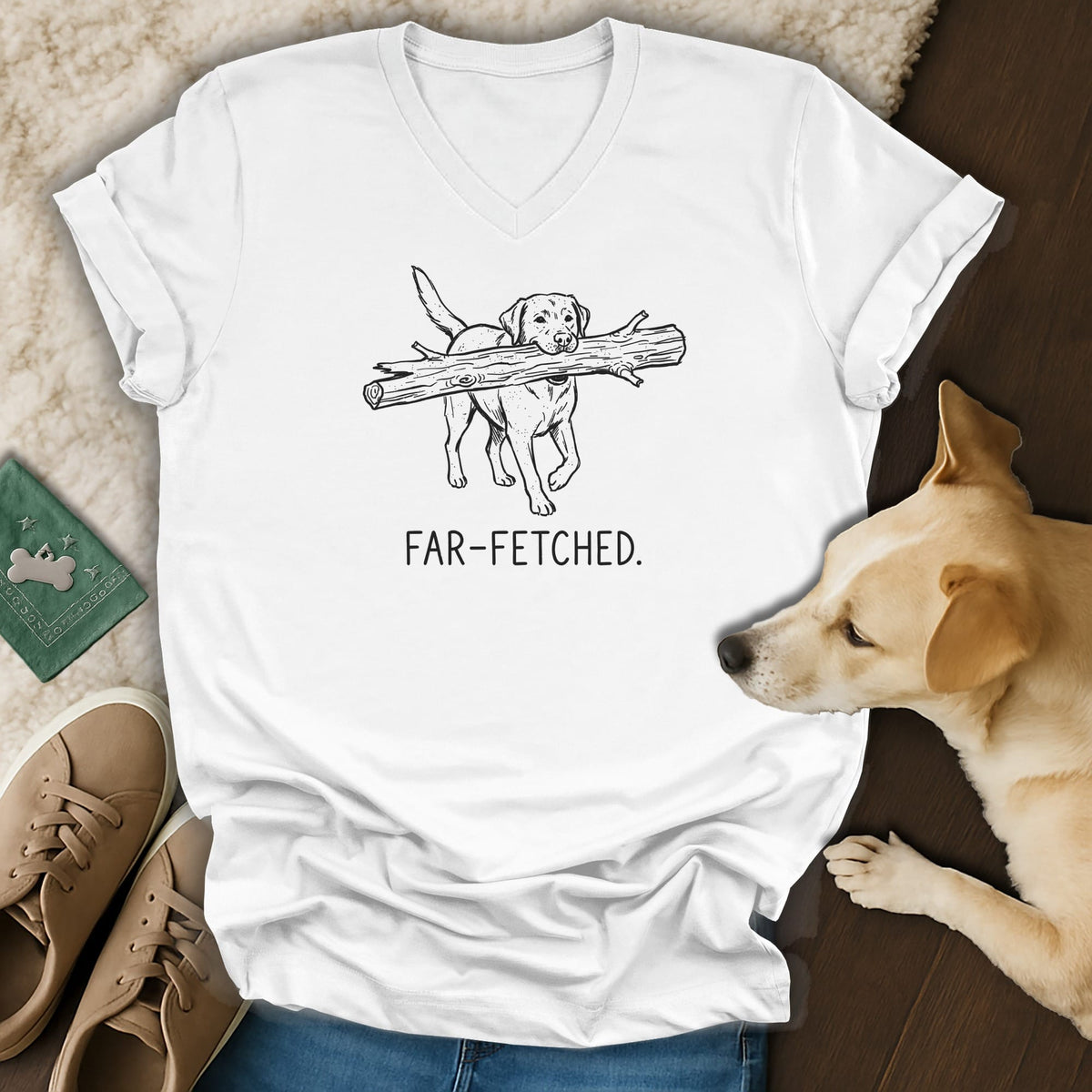 White t-shirt with sketch of dog carrying a log, saying "FAR-FETCHED."