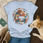 Dachshund graphic t-shirt with geometric pattern on light blue fabric.