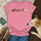 Pink t-shirt with dachshunds dressed as a vampire, skeleton, hot dog, and ghost.