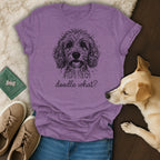 Purple t-shirt with a black line drawing of a doodle dog and text "doodle what?".