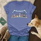 Blue t-shirt with dogs in patriotic hats and a banner reading "Stars, Stripes, & Tail Wags."