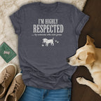 T-shirt with text "I'M HIGHLY RESPECTED ... by someone who eats grass" and dog graphic.