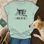 Light green t-shirt with a dog digging up a bone and text "401 K-9.".
