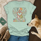 Mint t-shirt with a colorful dog and heart graphic, text reads "Wag With Your Whole Heart".