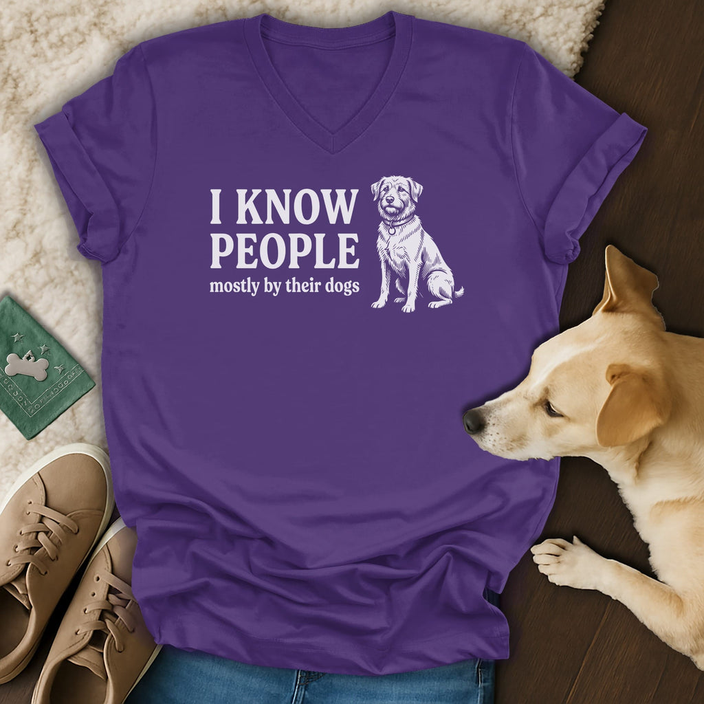 Purple v-neck t-shirt with white text and a dog illustration.