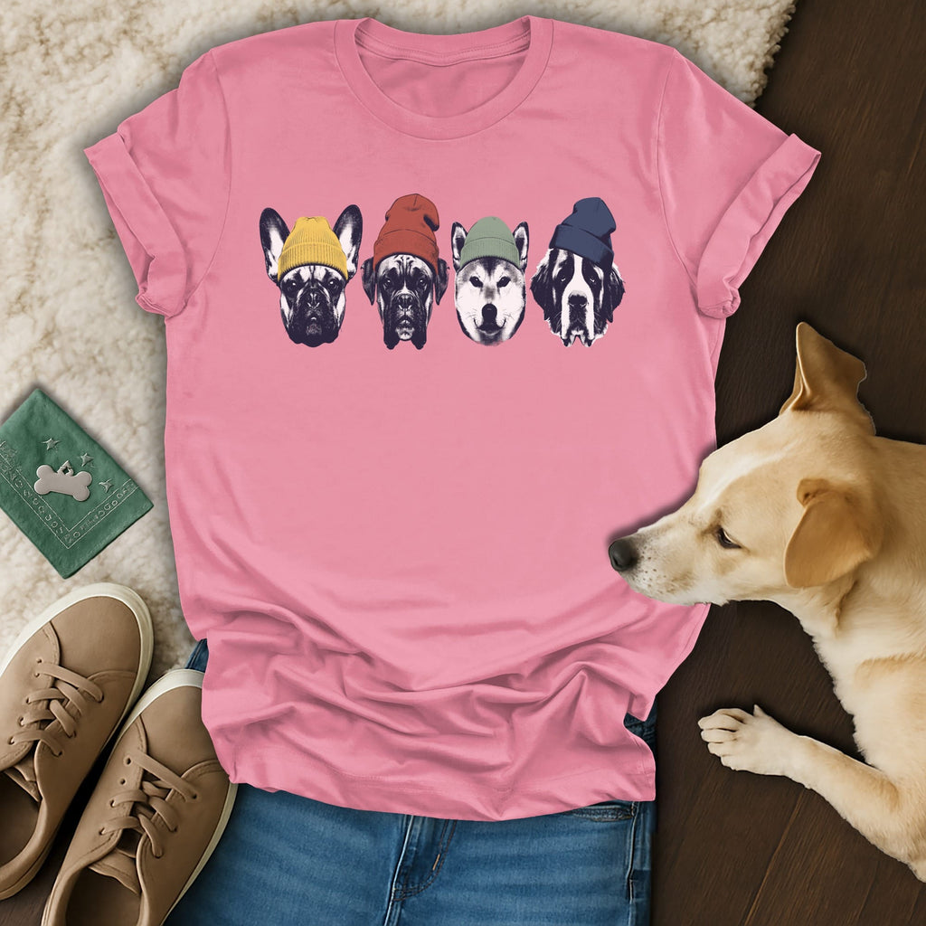 Four dogs wearing beanies on a pink t-shirt.