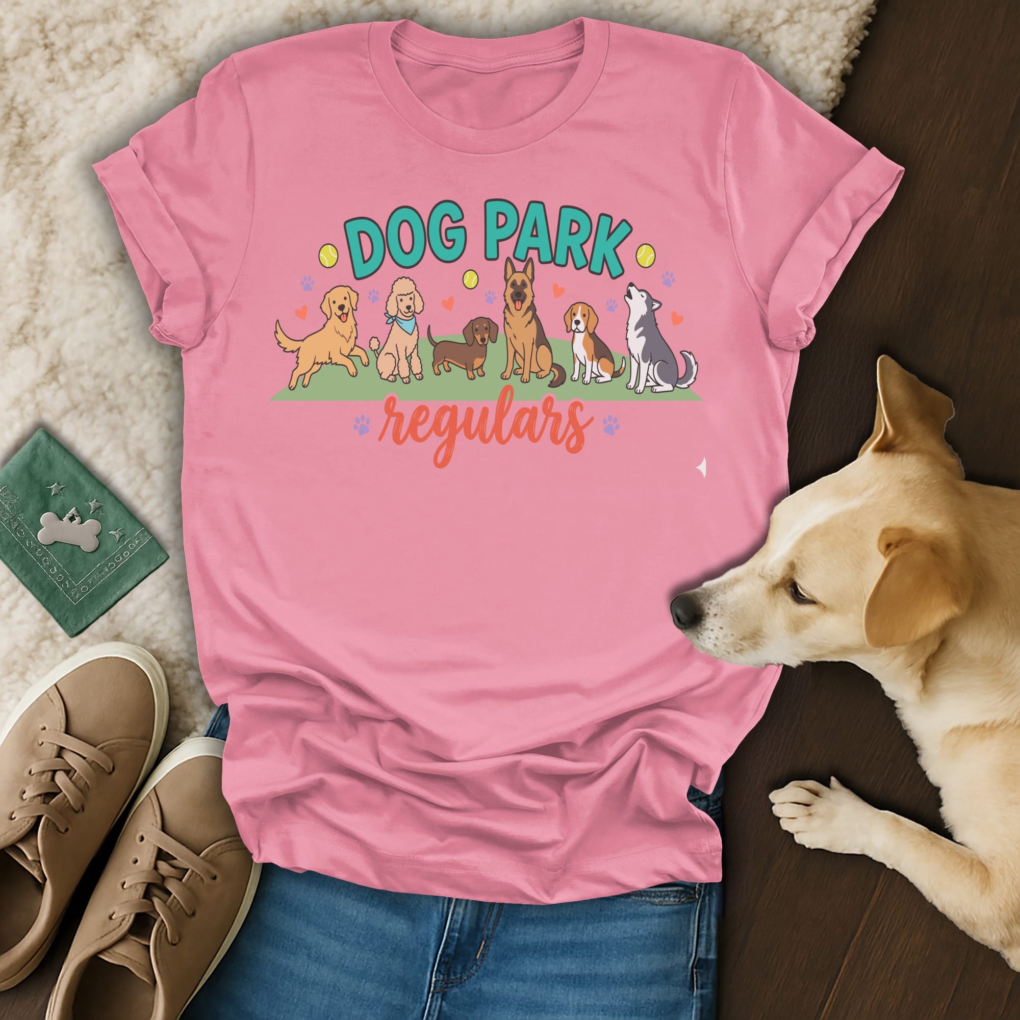 Pink t-shirt with "DOG PARK regulars" text and illustrations of dogs.