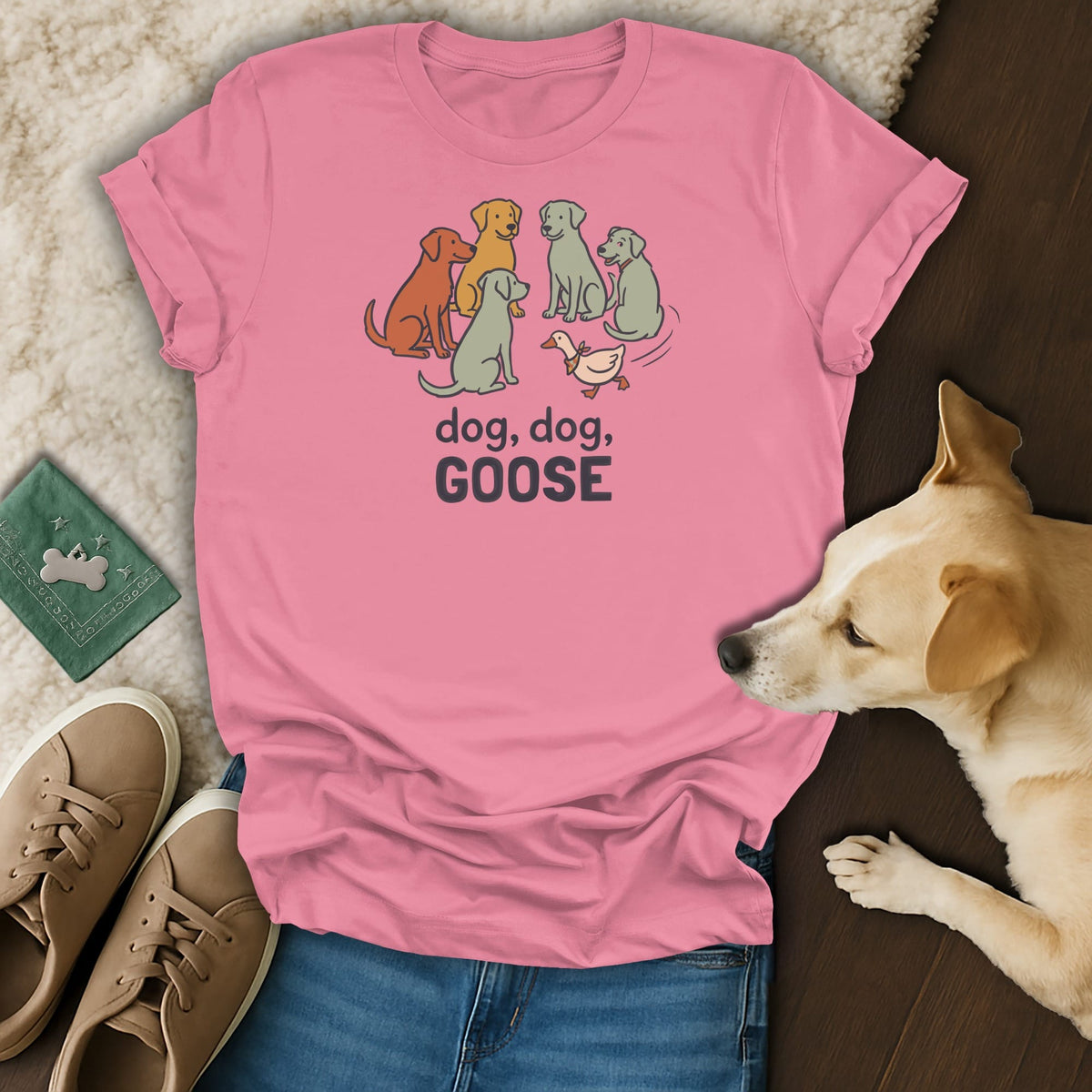 Pink t-shirt with cartoon dogs and a duck, text reads "dog, dog, GOOSE".