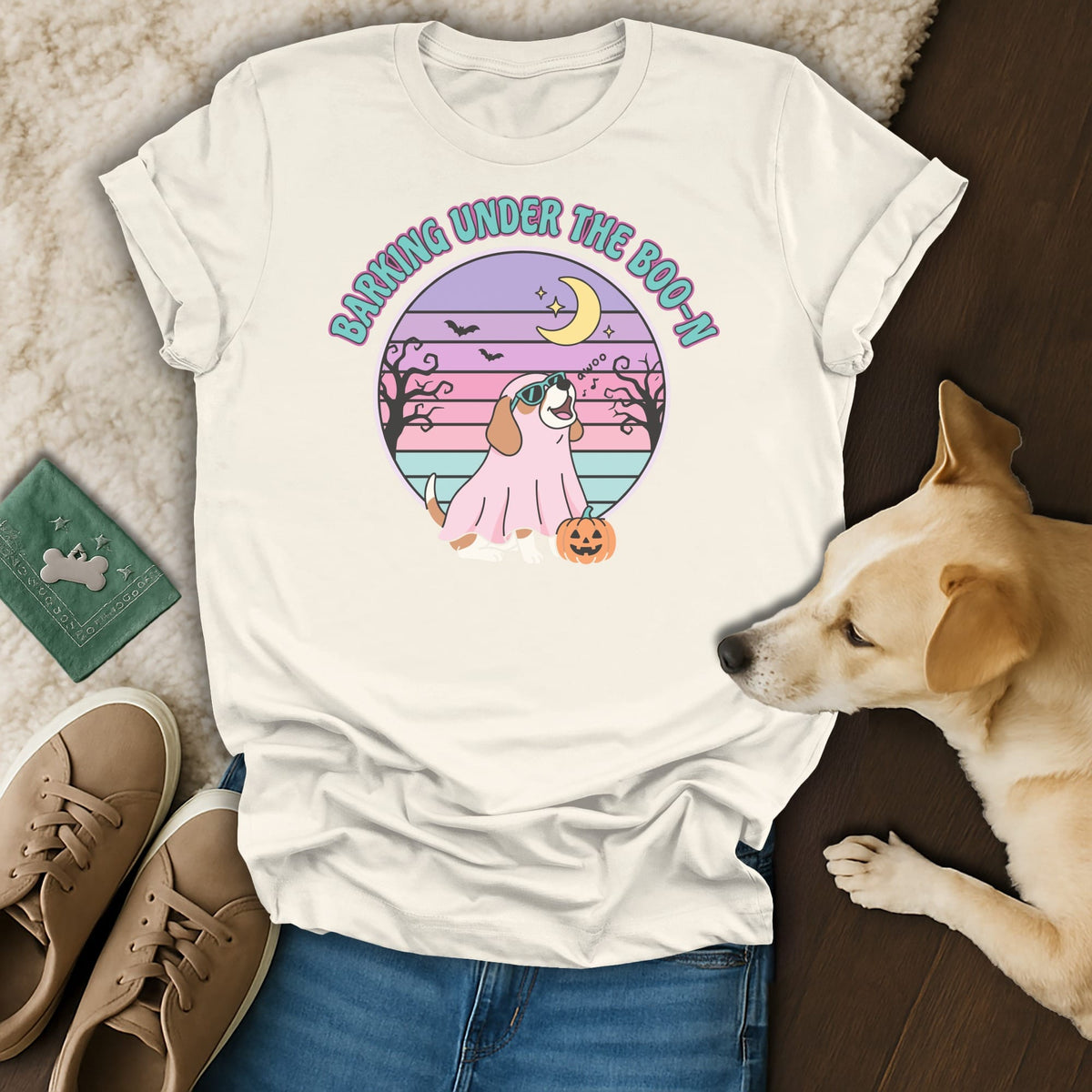T-shirt with "Barking Under the Boo-n" text, a dog in a ghost costume, and a pumpkin.