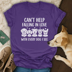 Purple t-shirt with "Can't Help Falling in Love With Every Dog I See" and dog illustrations.