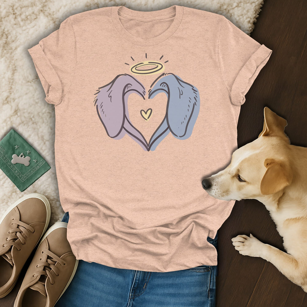 Peach t-shirt with cartoon dog ears forming a heart and a halo.