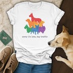 White t-shirt with rainbow dogs graphic and text "sorry i'm late, dog traffic".