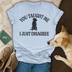 Light blue t-shirt with "You taught me I just disagree" and dog graphic.