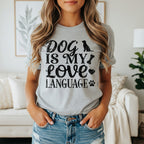 Gray t-shirt with black distressed text "Dog Is My Love Language" and dog icons.