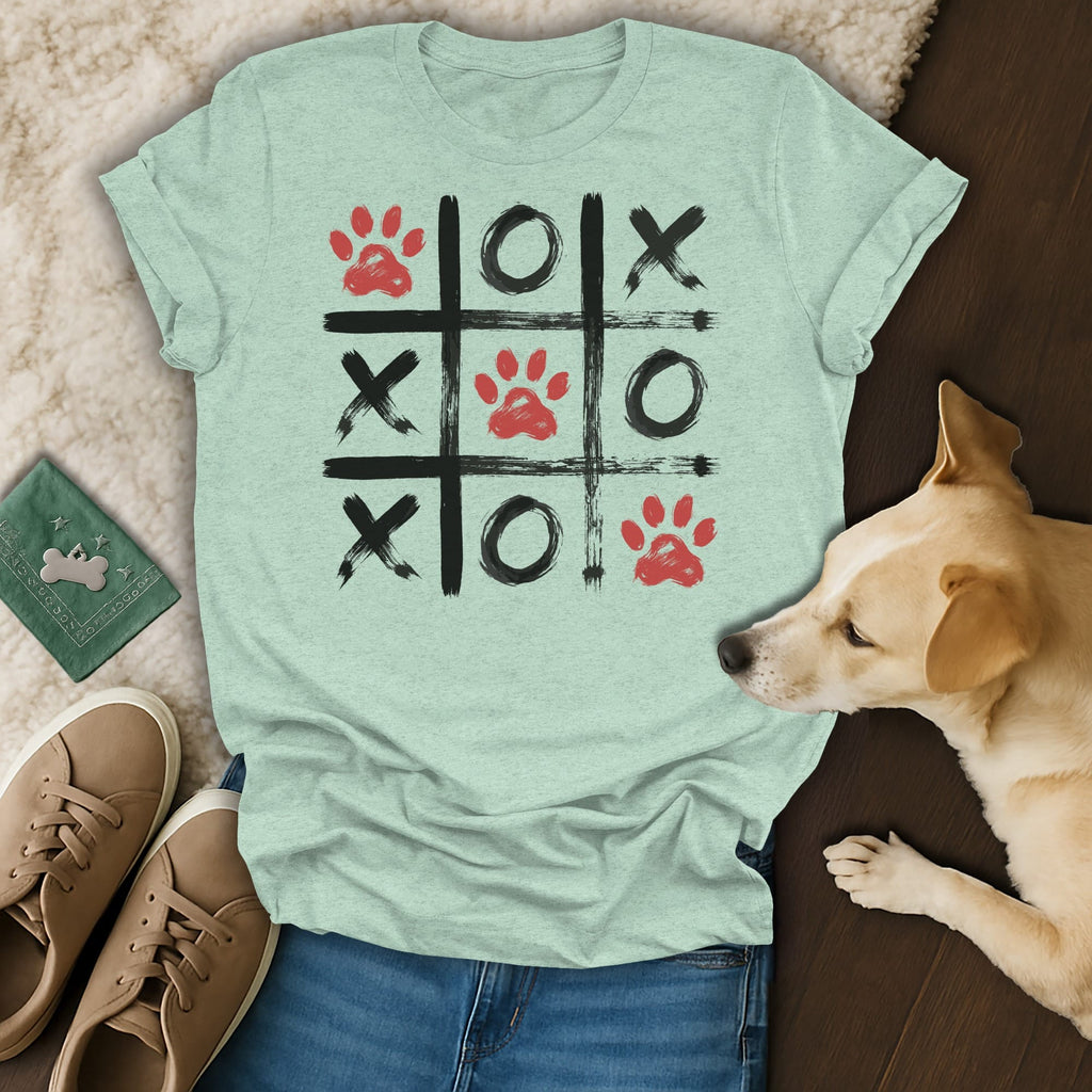 Light teal t-shirt with a tic-tac-toe grid featuring paw prints and Xs and Os.