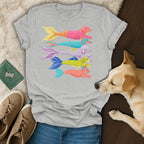 Grey t-shirt with a stacked illustration of colorful mermaid dogs.