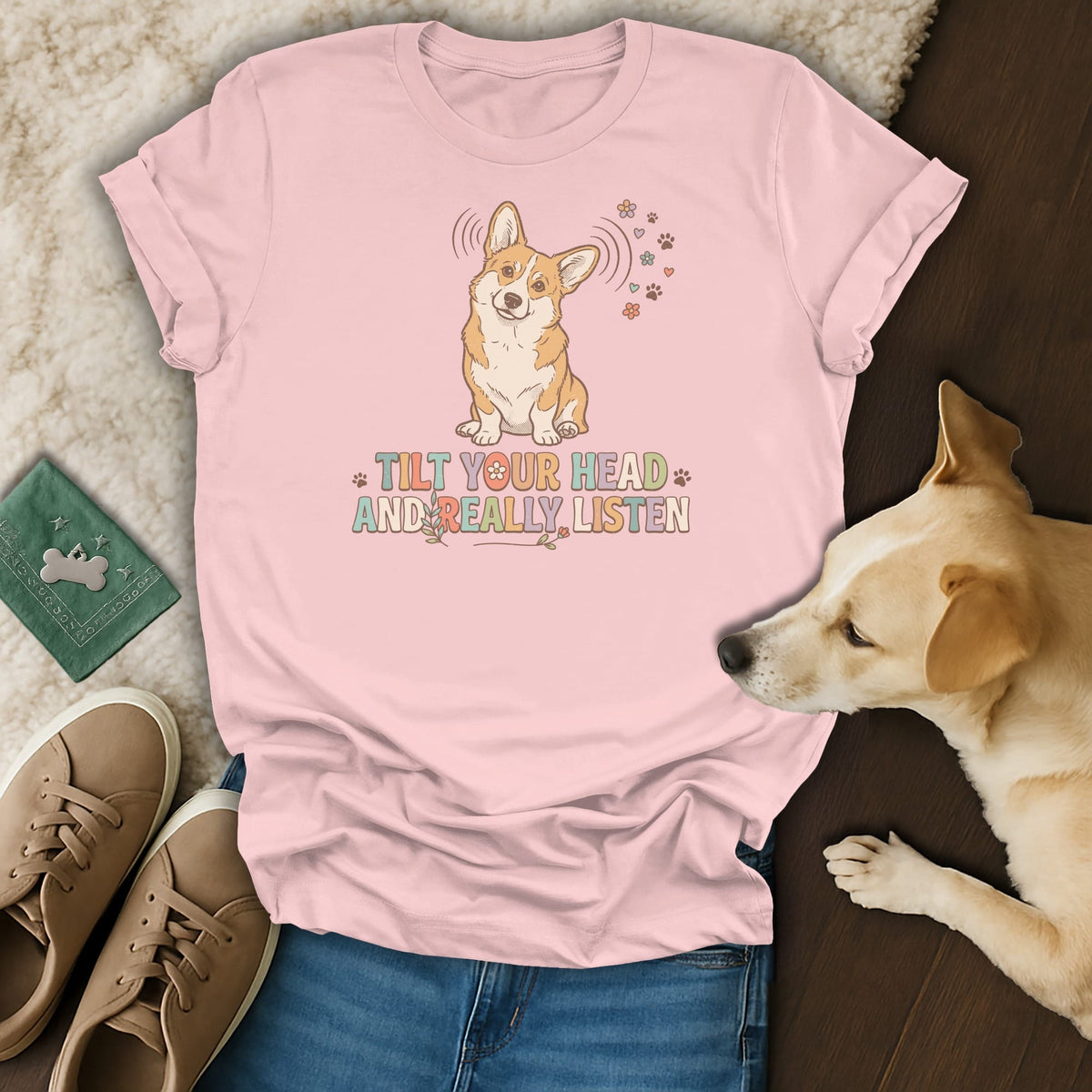 Pink t-shirt with a corgi graphic and text "TILT YOUR HEAD AND REALLY LISTEN".