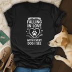 Black v-neck t-shirt with "Can't Help Falling in Love With Every Dog I See" text and paw print heart.