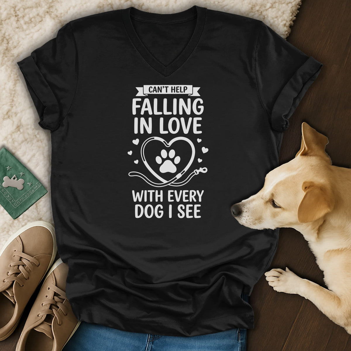 Black v-neck t-shirt with "Can't Help Falling in Love With Every Dog I See" text and paw print heart.